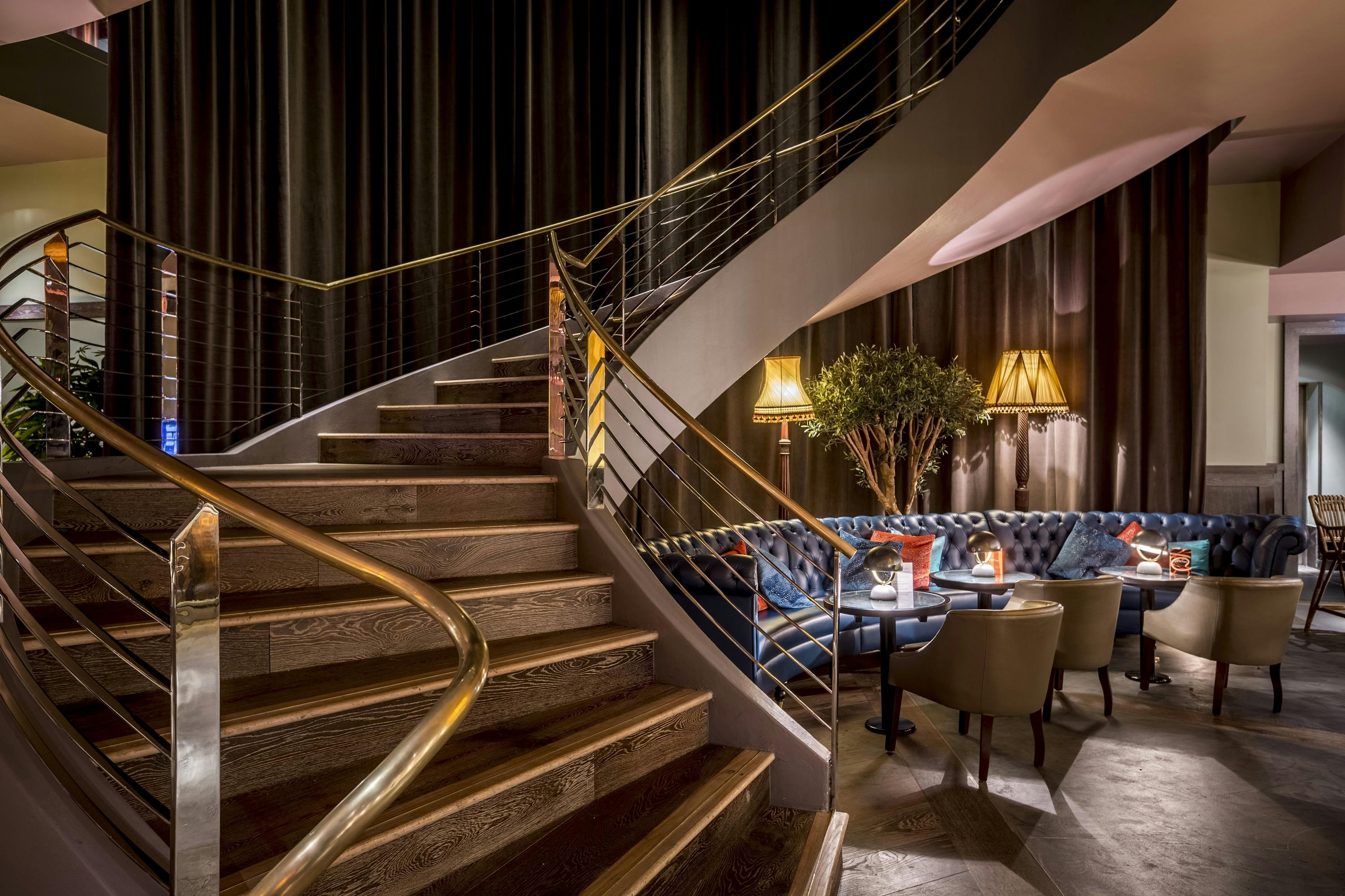 Elegant staircase at The Club, 100 Wardour Street, ideal for networking events and gatherings.