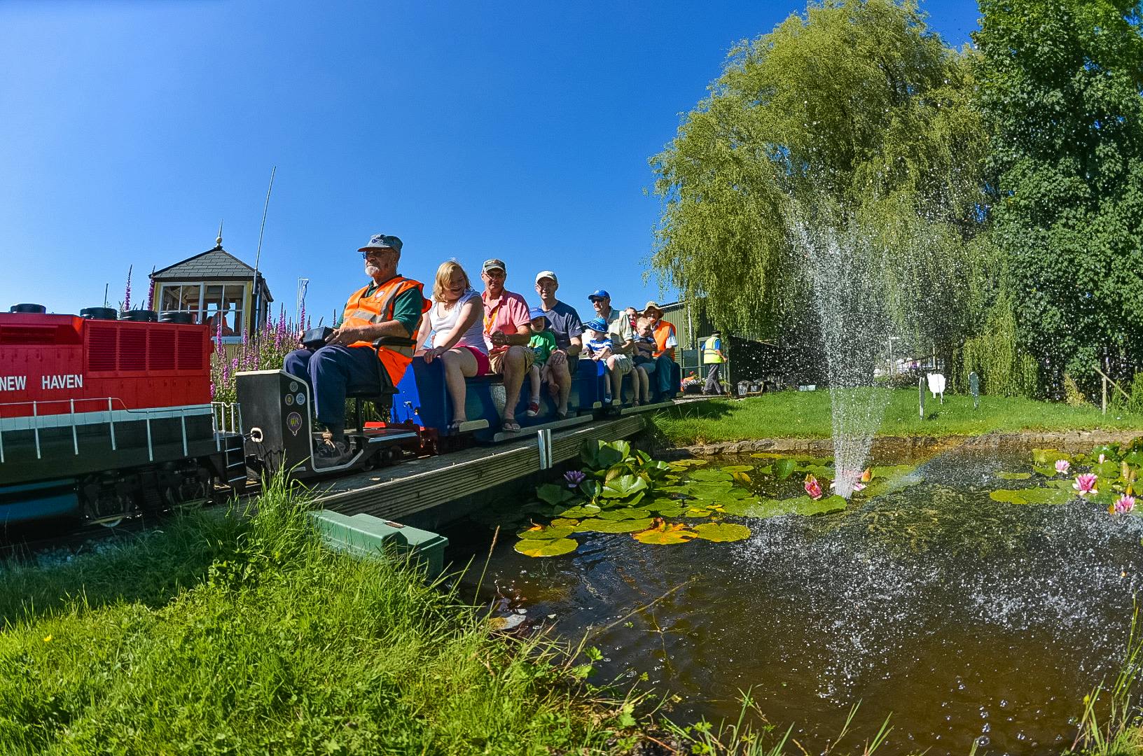 Miniature train ride at outdoor event in Bath & West Showground, perfect for family gatherings.