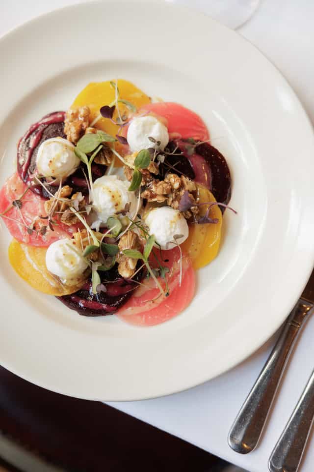Vibrant vegetable dish with cheese, perfect for event catering and dining experiences.