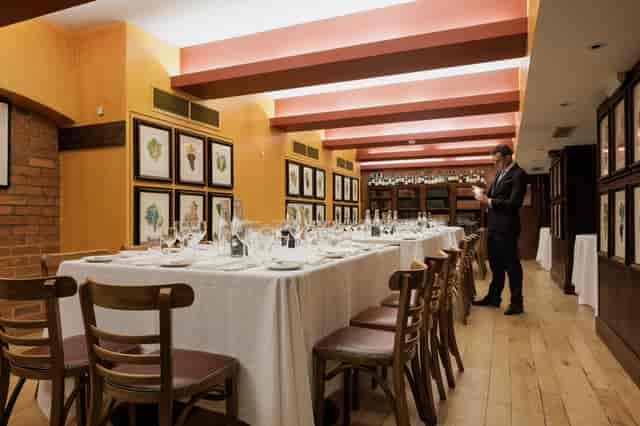 Elegant dining room setup for intimate corporate dinner or networking event.