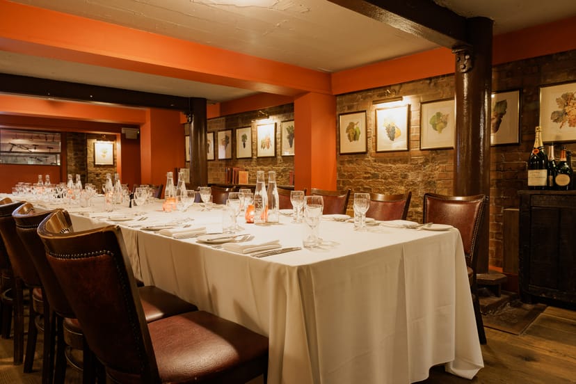 Elegant wine cellar dining room for intimate gatherings and corporate events.