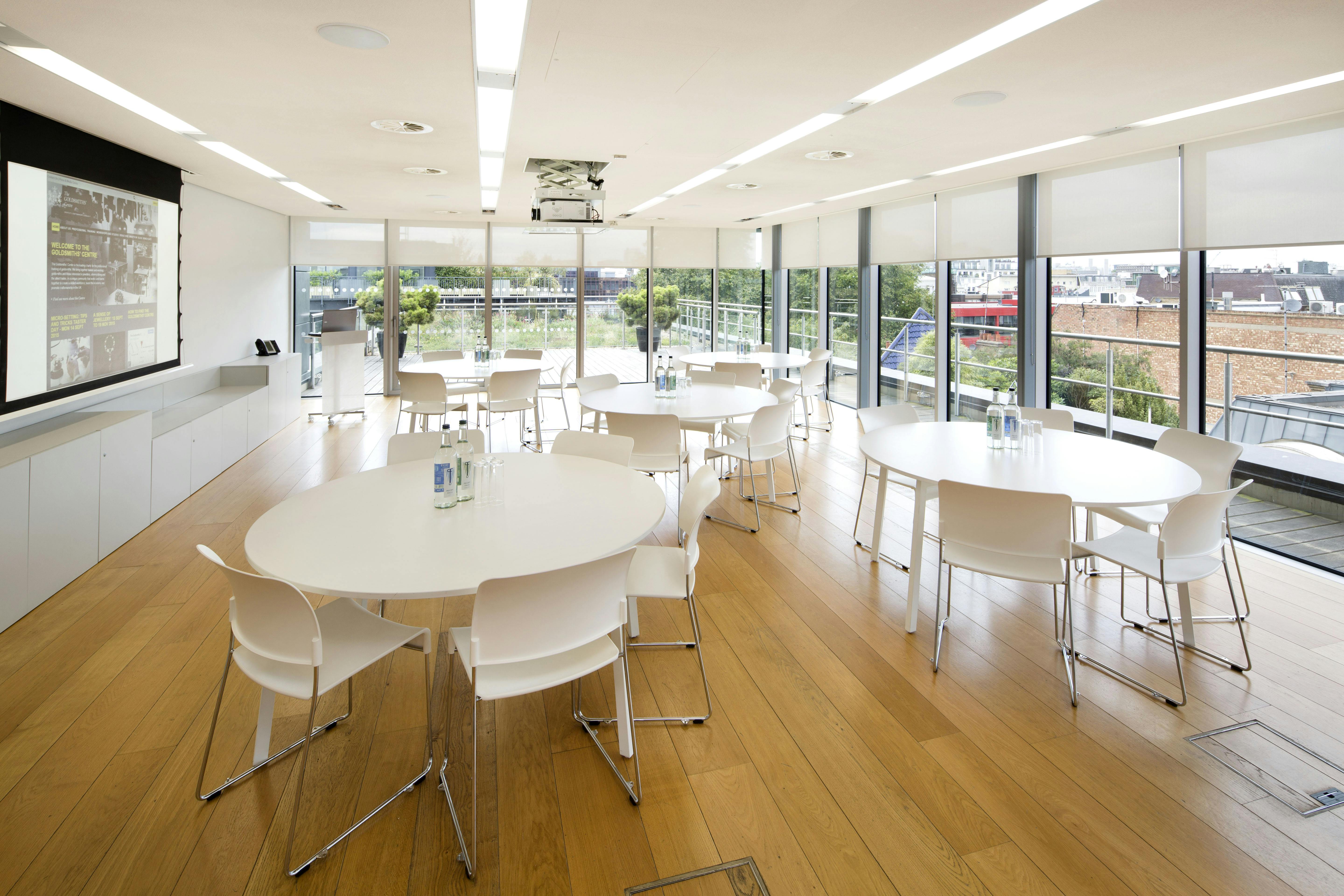 Agas Harding Conference Room with round tables, ideal for workshops and meetings.