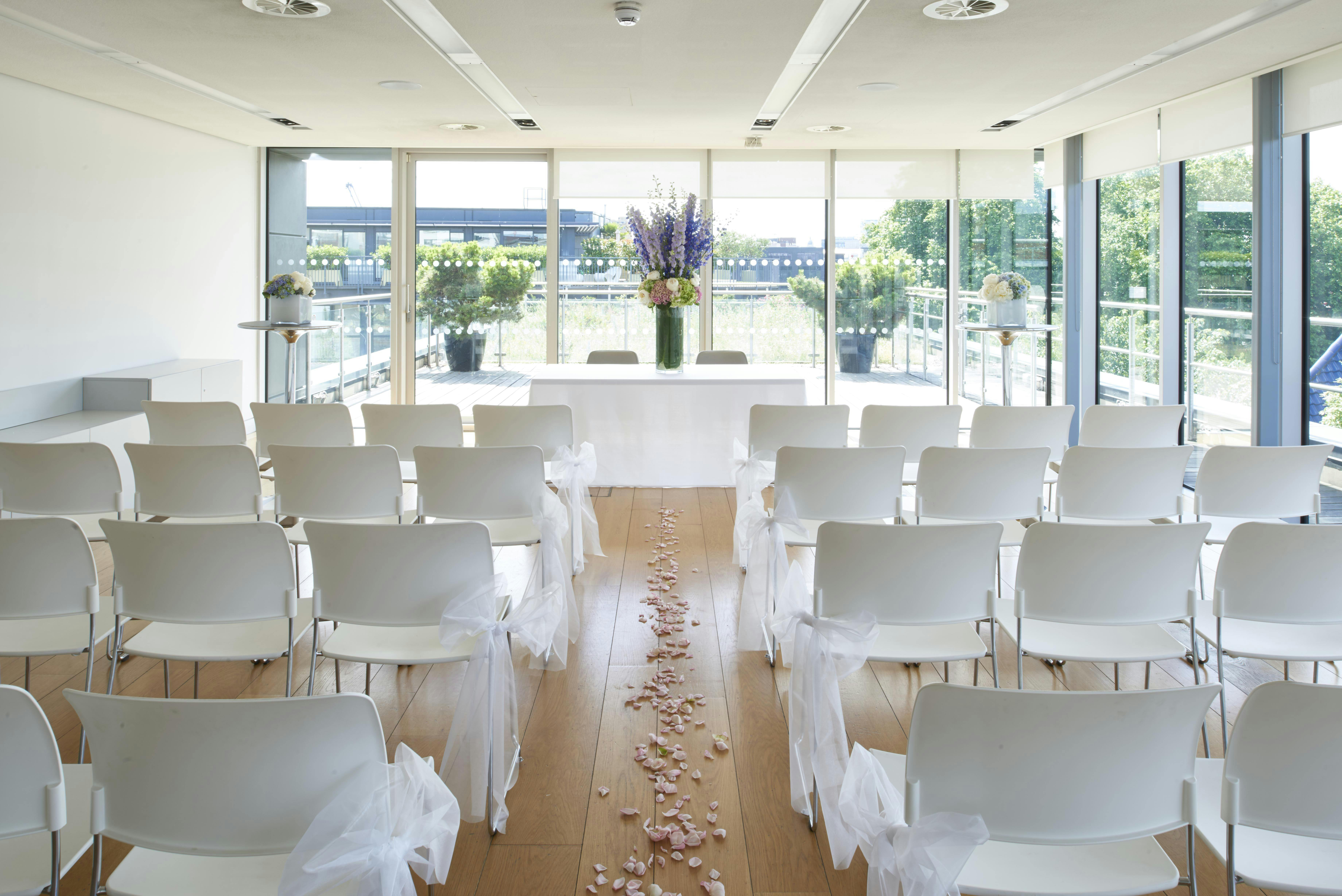 Agas Harding Conference Room set for a wedding ceremony with elegant floral decor.
