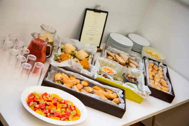 Catering setup with pastries and sandwiches for networking events at The Goldsmiths' Centre.
