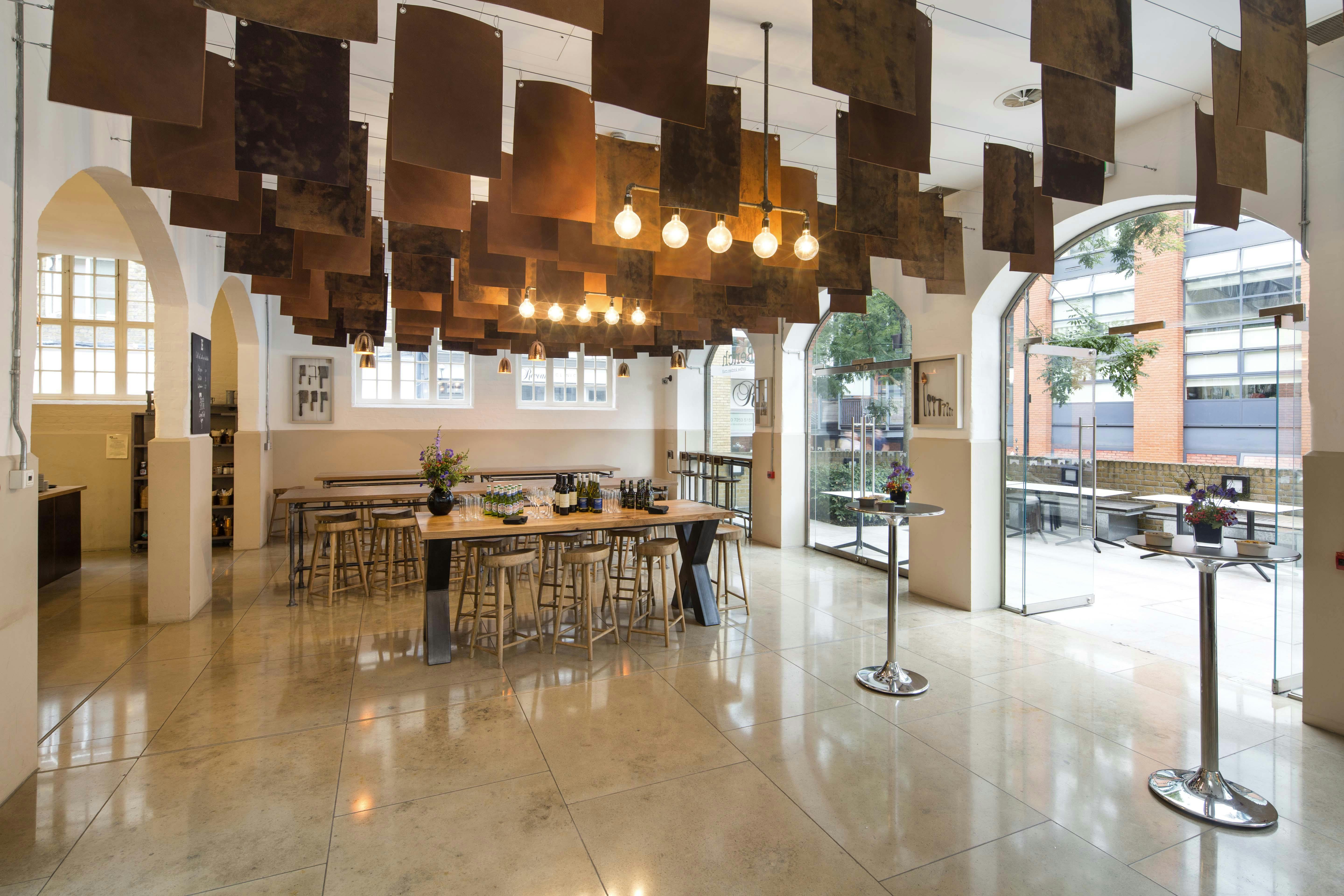 Modern event space with warm lighting, ideal for networking and gatherings.