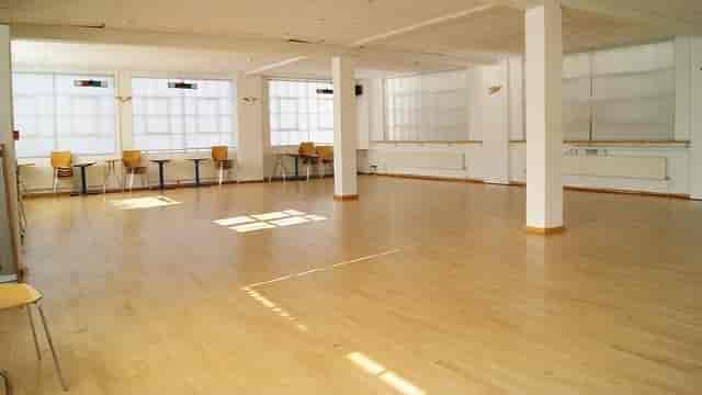 Spacious STUDIO 1 with wooden flooring for workshops and events at The Factory Fitness.