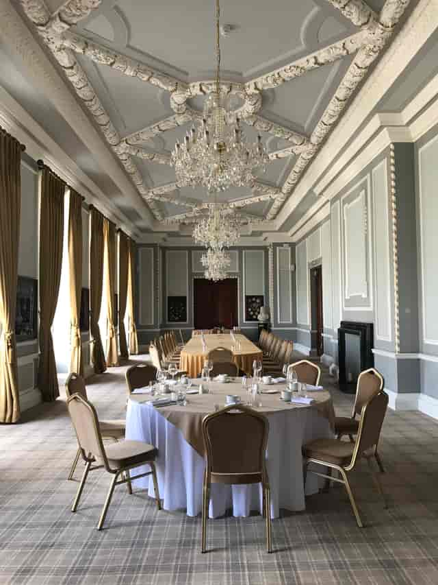 Elegant meeting space in Manchester Hall with long table, ideal for corporate events.