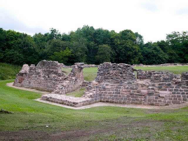 Historic stone ruin in lush Weoley Castle, perfect for unique outdoor events.