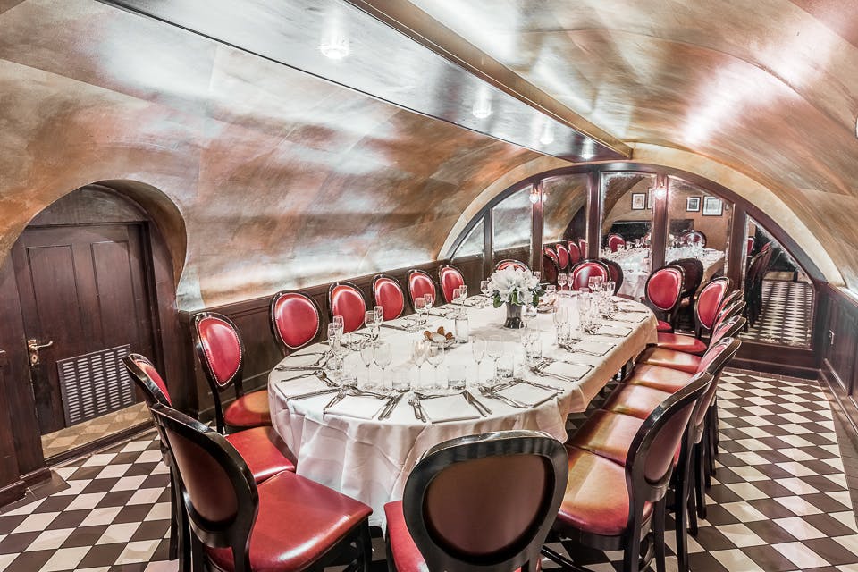 Elegant private dining space with arched ceiling for upscale events and intimate gatherings.