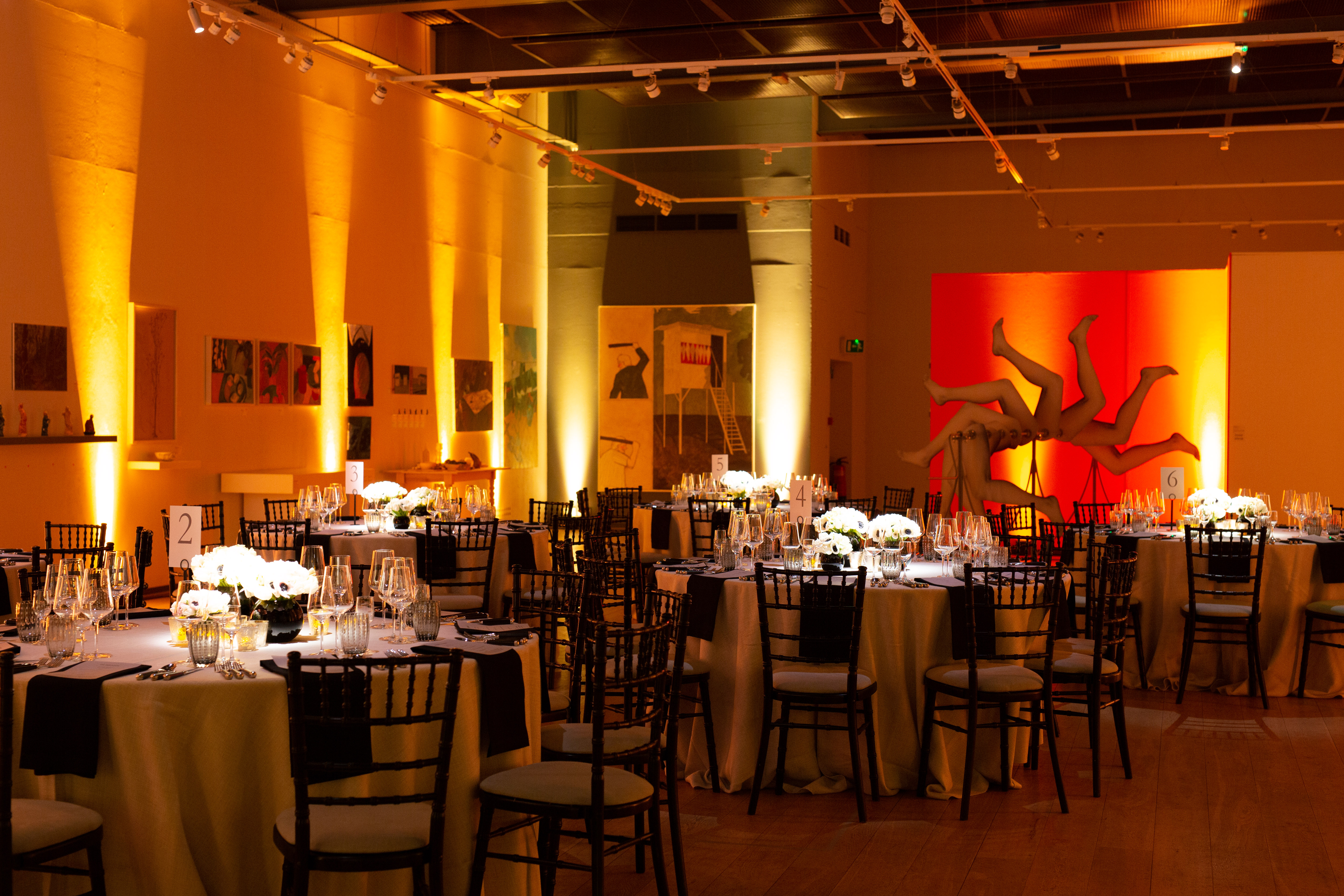 Elegant event space with round tables, ideal for gala or formal dinner at Mall Galleries. - Banner