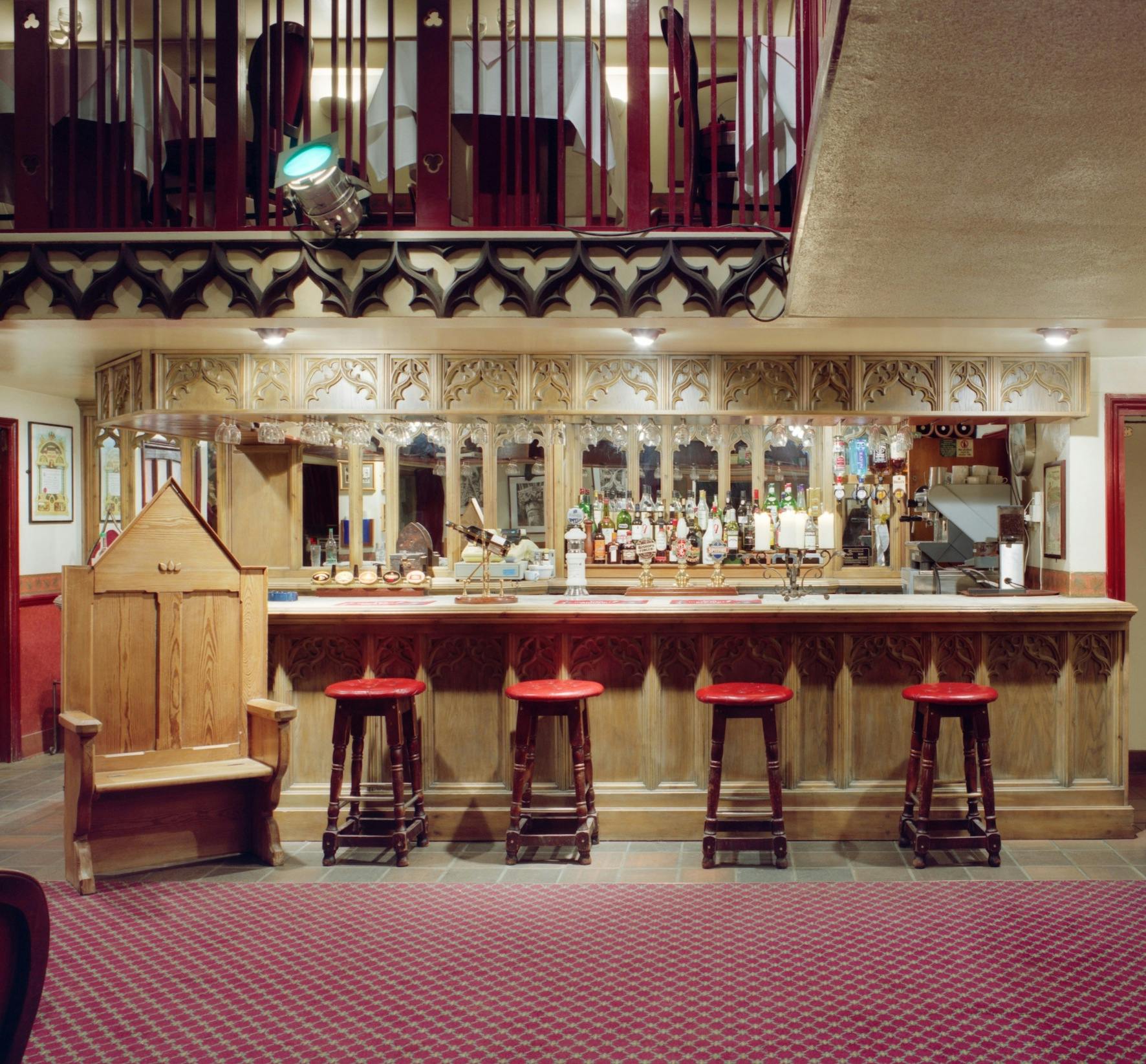 Gothic Bar & Restaurant with intricate wood details, ideal for networking events and gatherings.