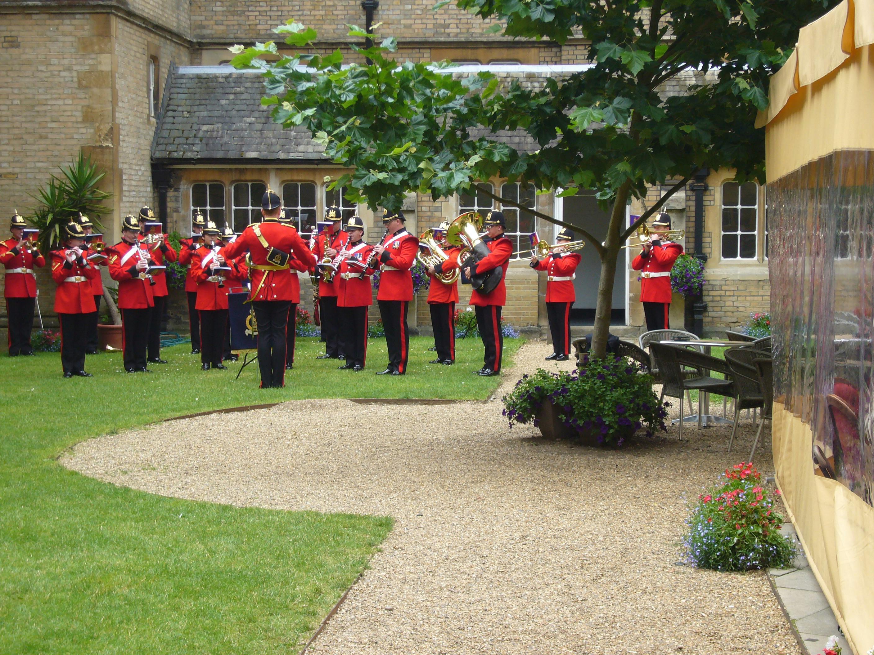 Gothic Bar outdoor event with brass band in lush garden setting, perfect for celebrations.