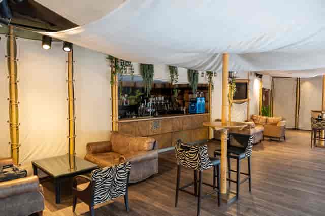 Serengeti Suite at Chessington: stylish event space with zebra chairs for gatherings.