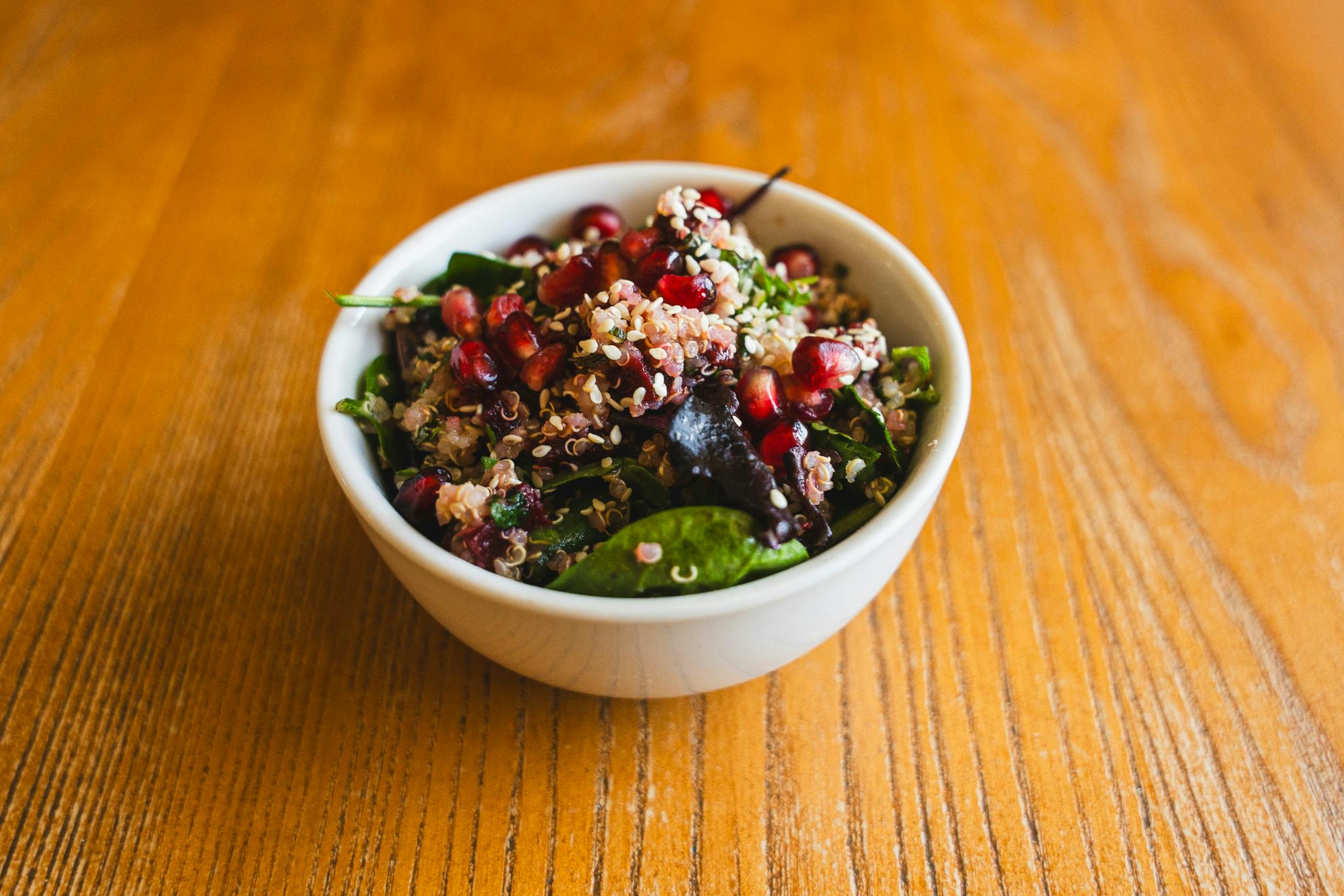 Vibrant salad bowl with quinoa and pomegranate at Chessington event catering.