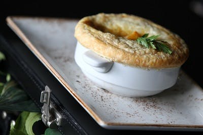 Serengeti Suite pot pie with golden crust, perfect for upscale events and gatherings.