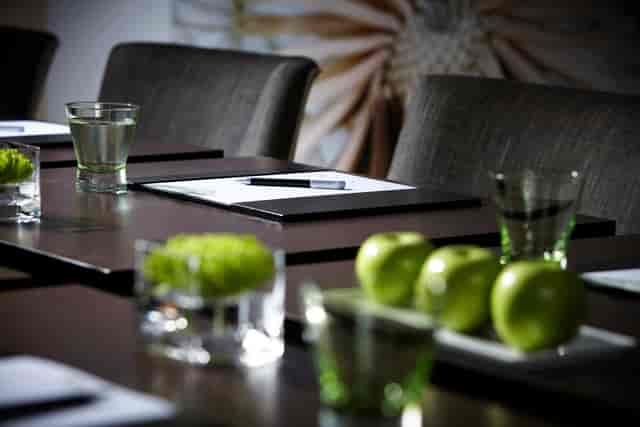 Boardroom setup at Rowhill Grange Hotel with sleek tables for corporate events.