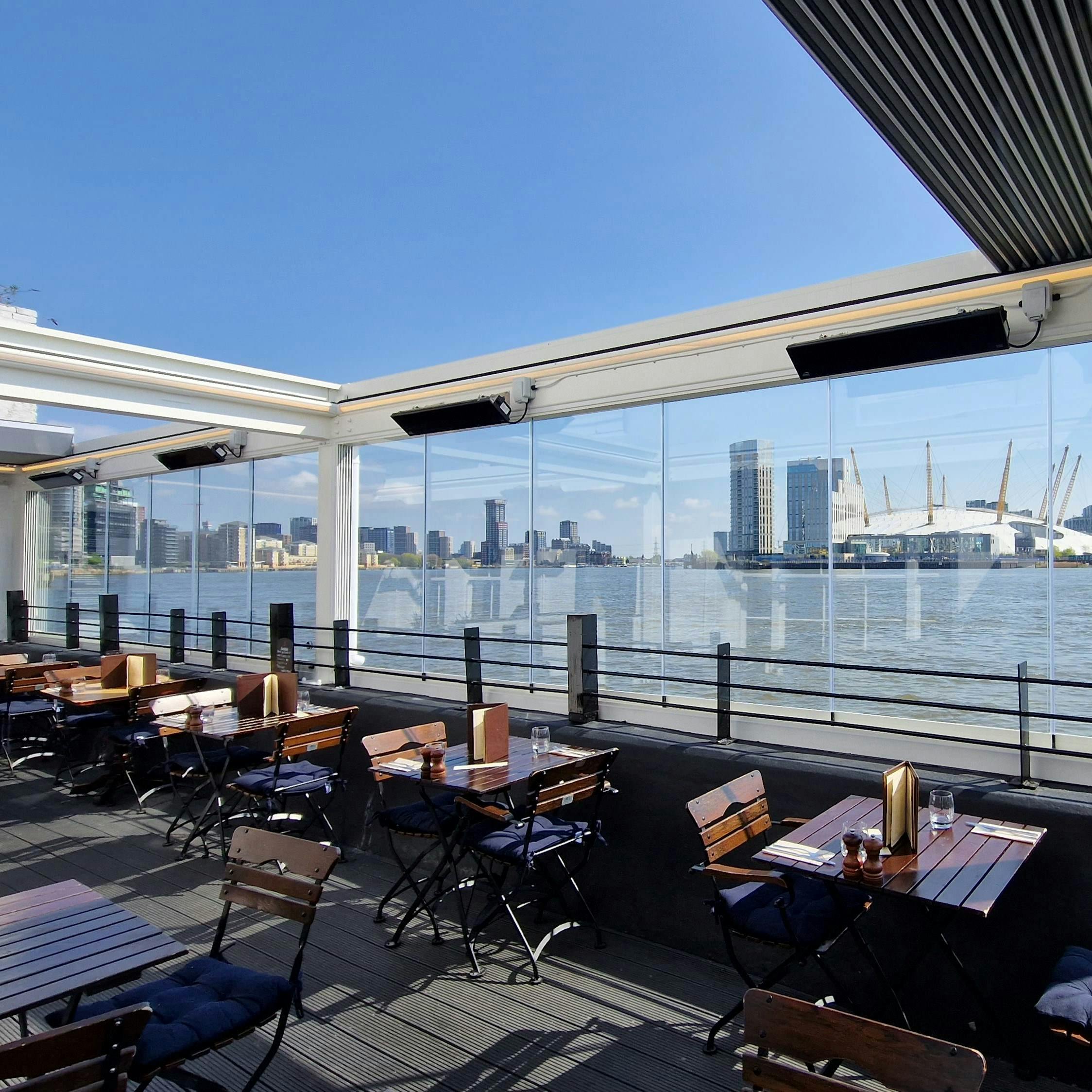 Stylish waterfront venue with skyline views, perfect for events and receptions.