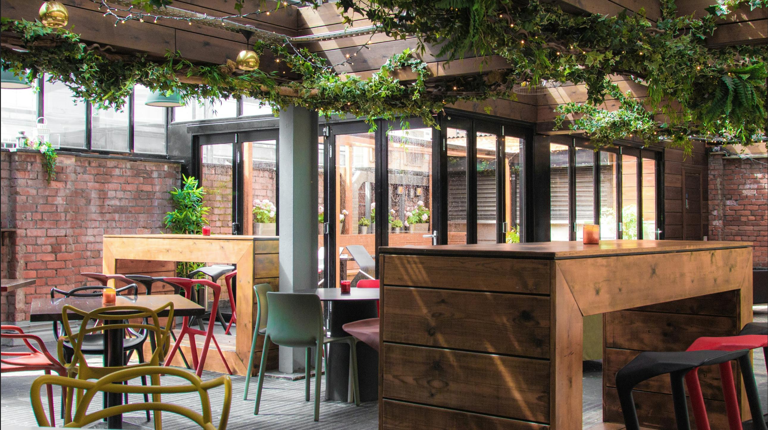 Modern event space with greenery, ideal for workshops and receptions at Brickhouse Social.