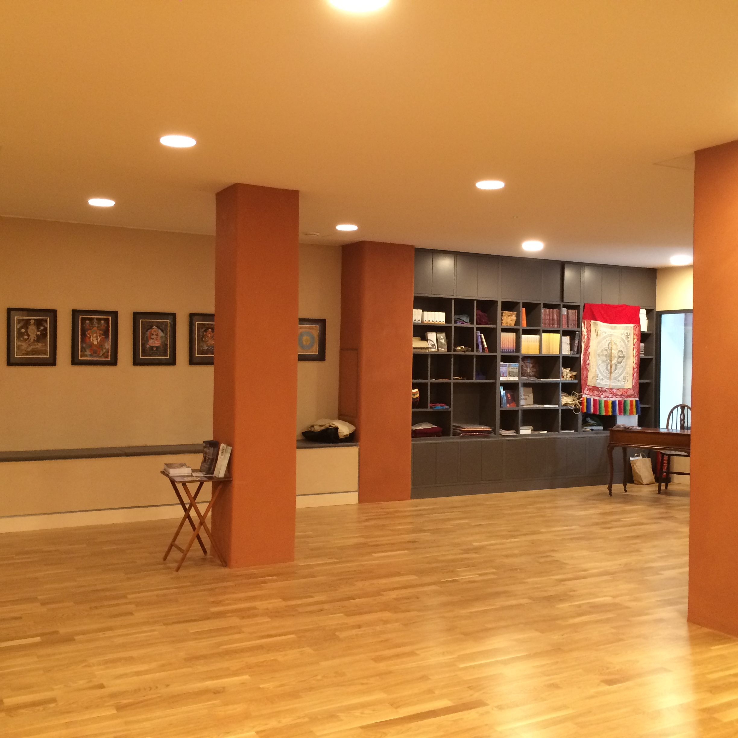 Main Room at Lekdanling Tibetan Cultural Centre, warm lighting for workshops and gatherings.