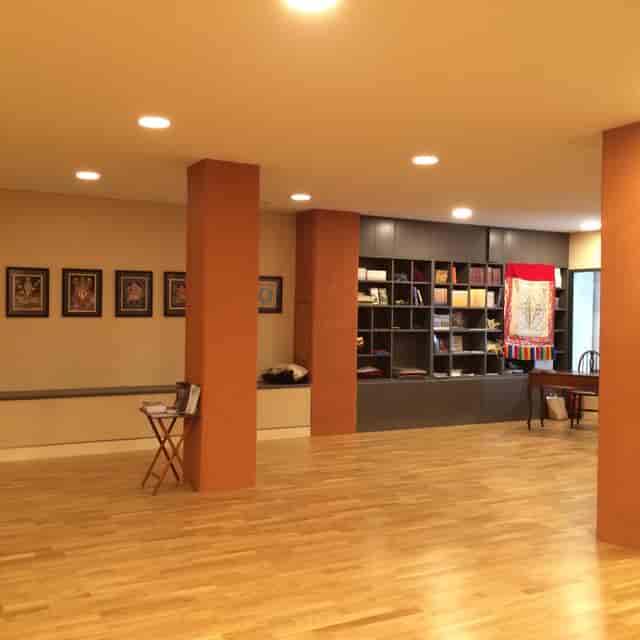 Main Room at Lekdanling Tibetan Cultural Centre, warm lighting for workshops and gatherings.