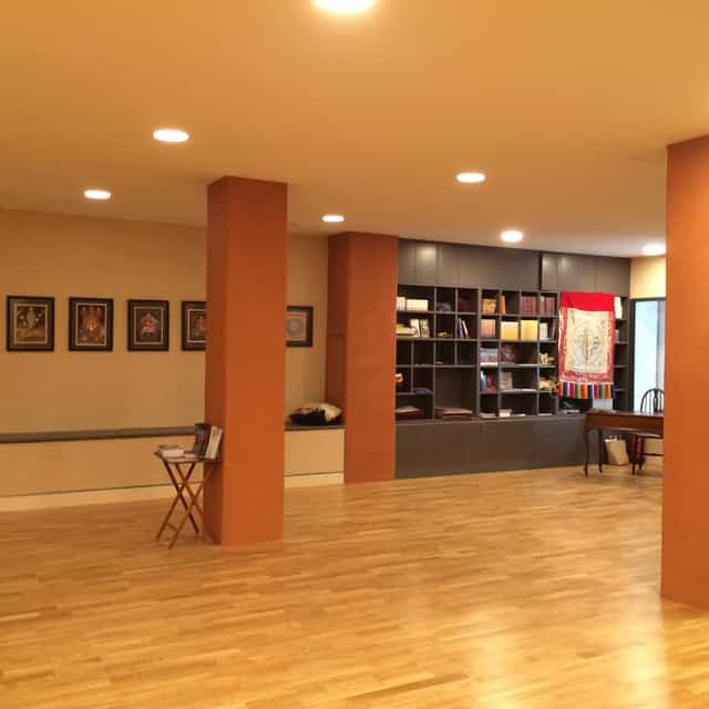 Main Room at Lekdanling Tibetan Cultural Centre, warm lighting for workshops and gatherings.