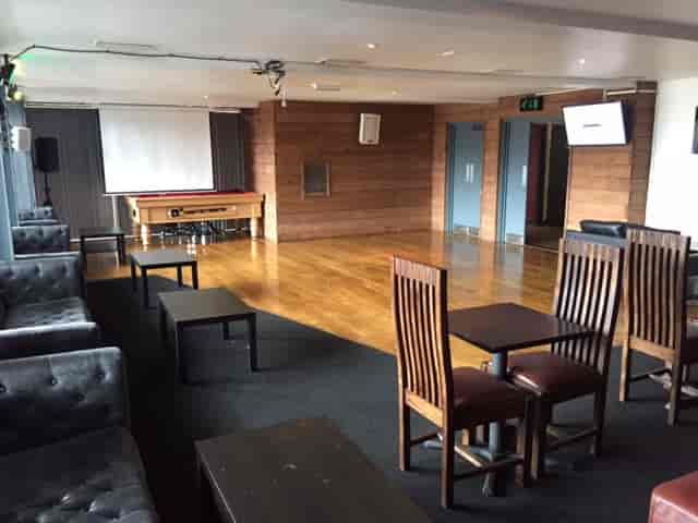 Hucknall Suite event space with mismatched seating for professional meetings and formal gatherings.