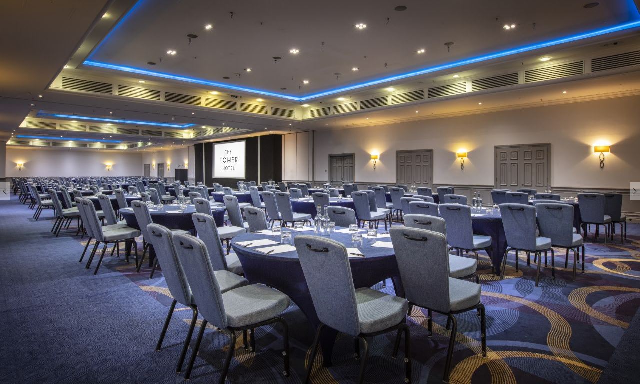 Tower Suite conference room with modern decor, ideal for corporate events and workshops. - Banner