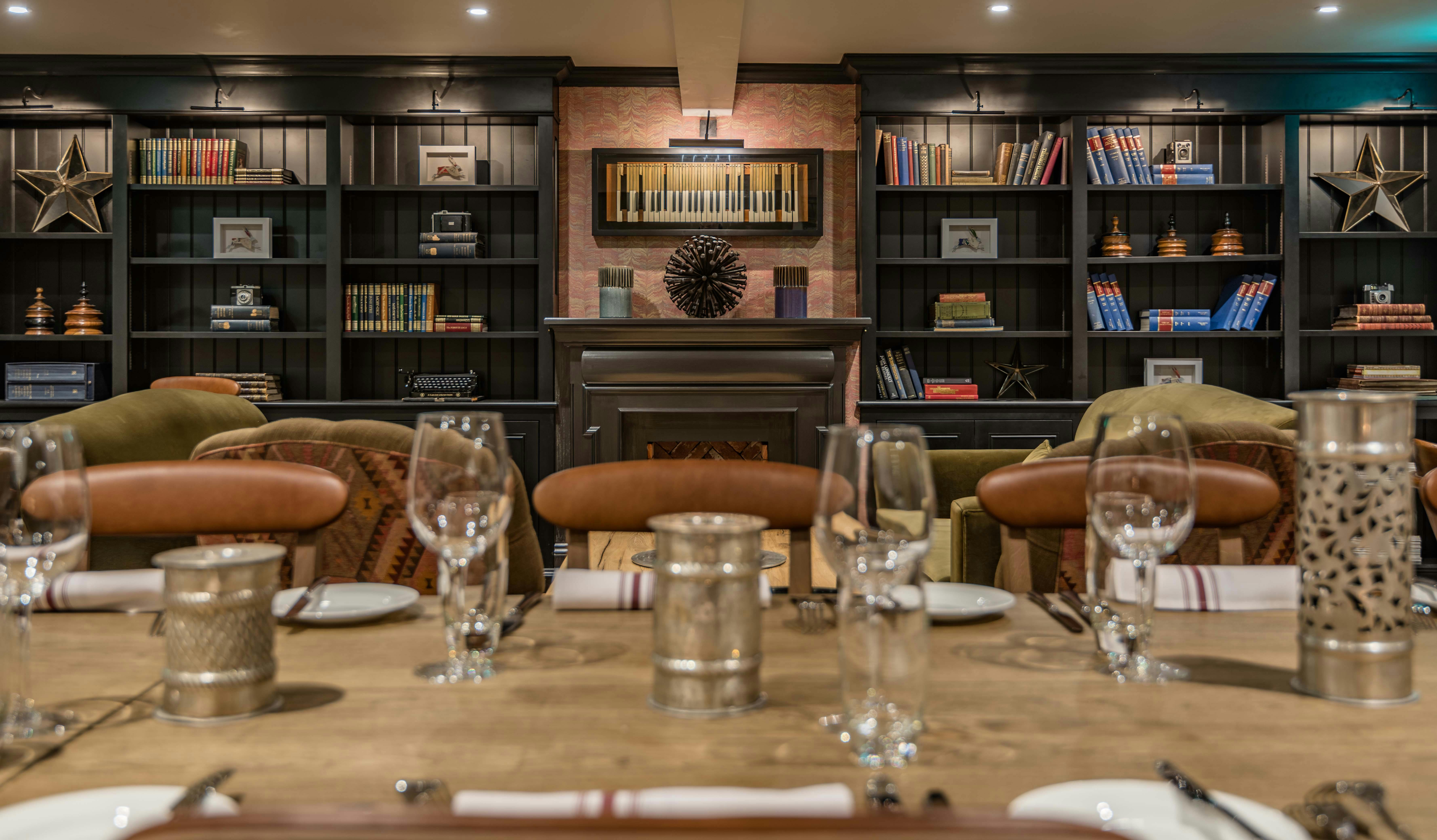 Intimate dining setup in The Mezzanine Lounge, perfect for meetings and private dinners.