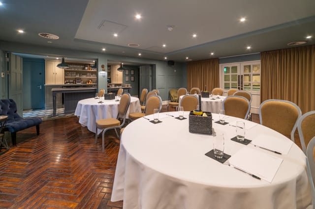 Elegant meeting room at The Hubs, perfect for workshops and small conferences.