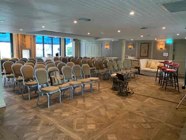 South Terrace meeting space with arranged chairs, ideal for workshops and presentations.