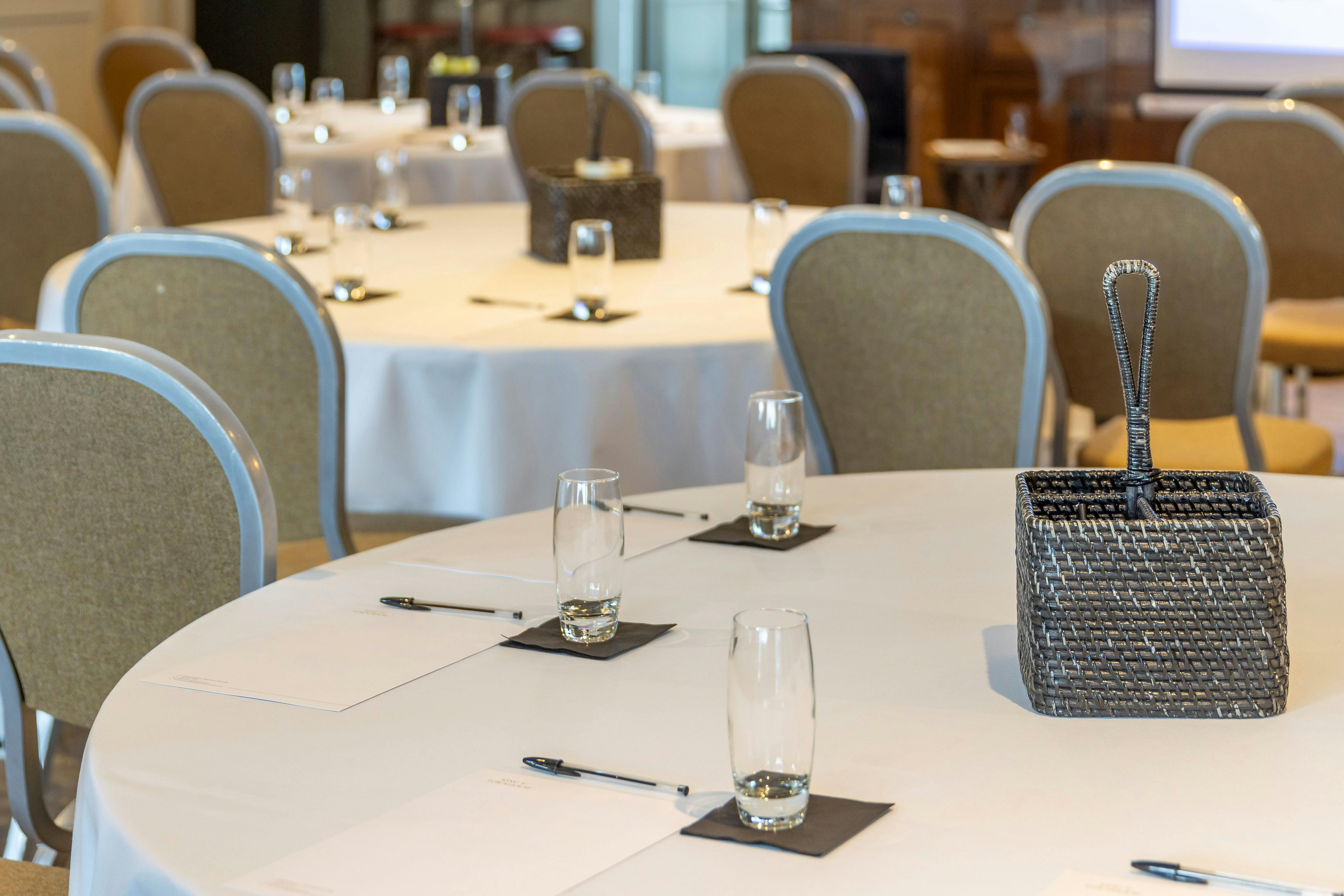 South Terrace meeting space with round tables, ideal for corporate events and discussions.