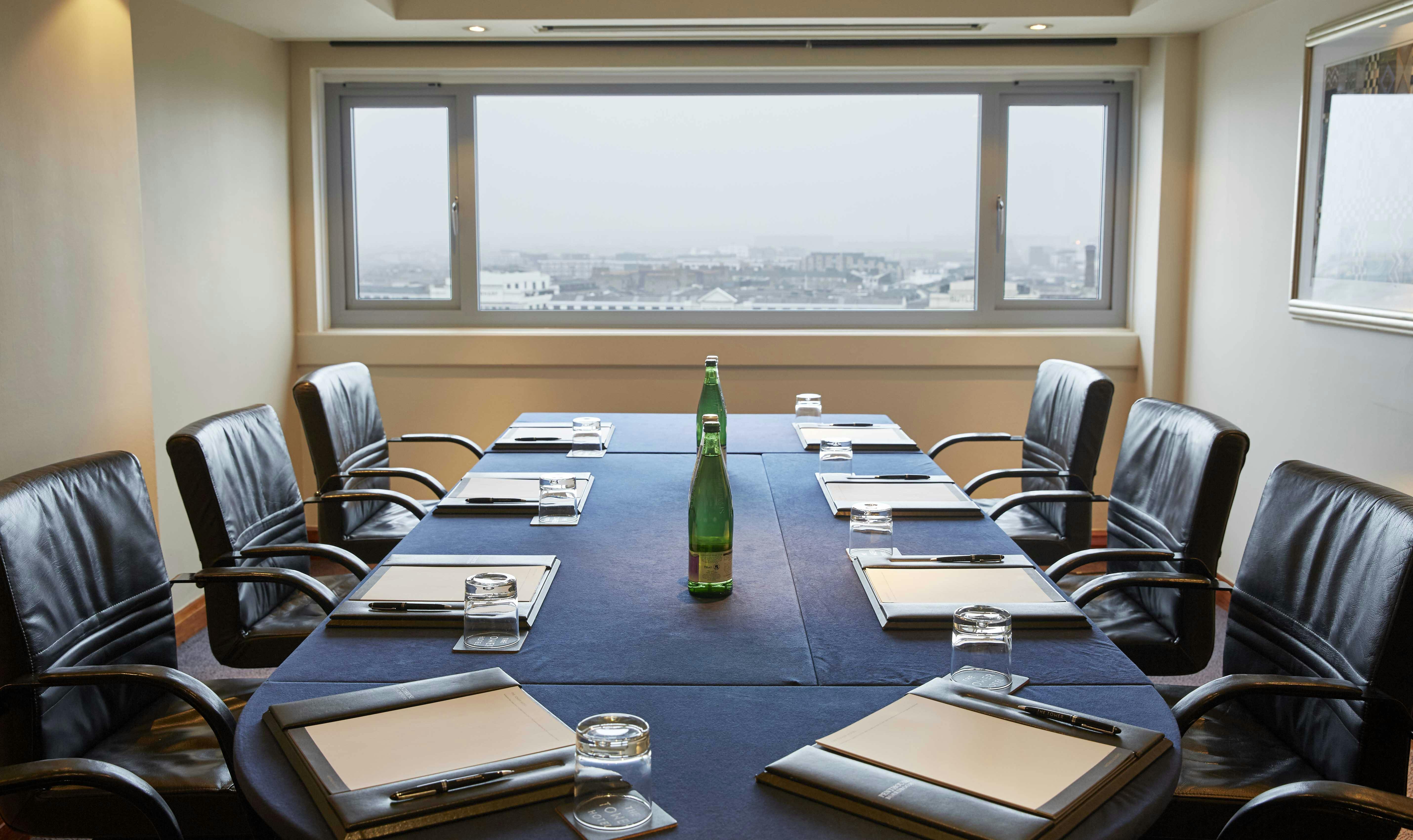 Bounty Suite meeting room with sleek table, panoramic view for professional events.