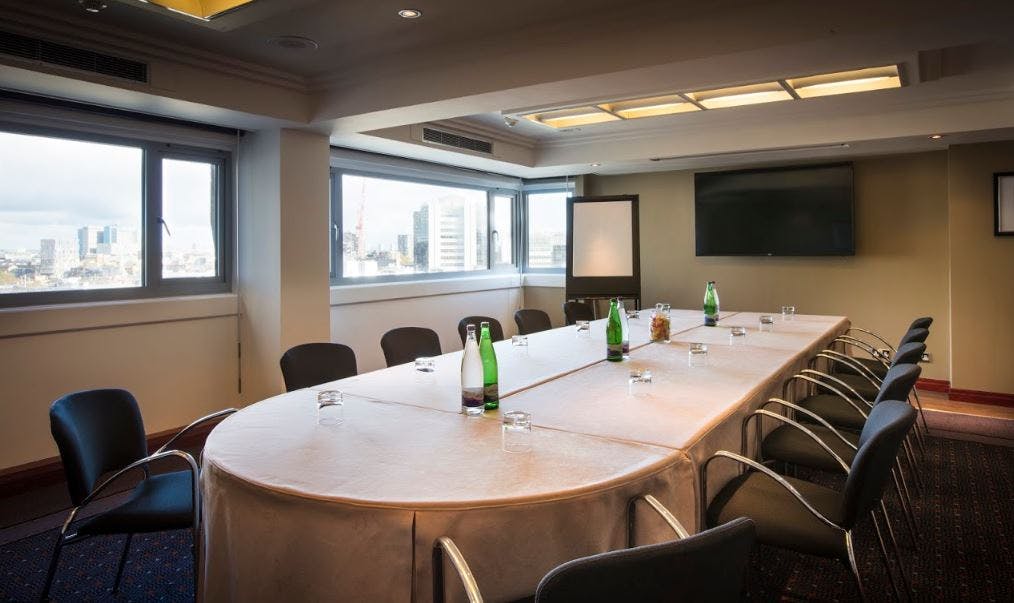 Nimrod Suite meeting room with oval table, ideal for professional events and presentations.