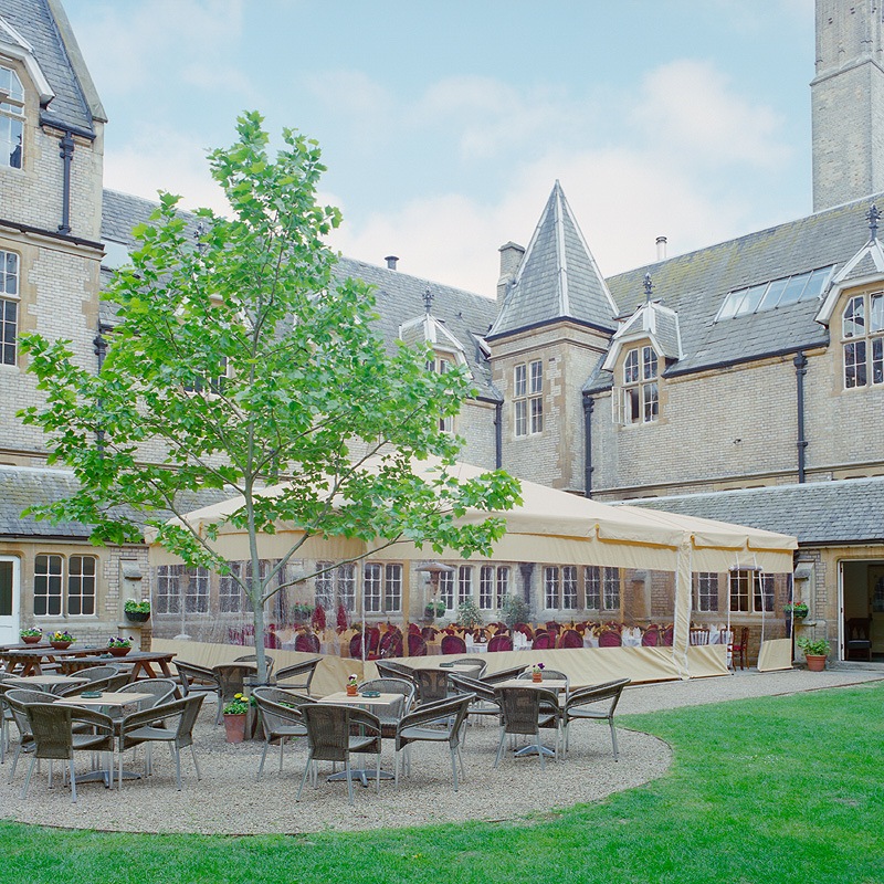 Charming outdoor event space with marquee at Le Gothique, ideal for weddings and gatherings. - Banner