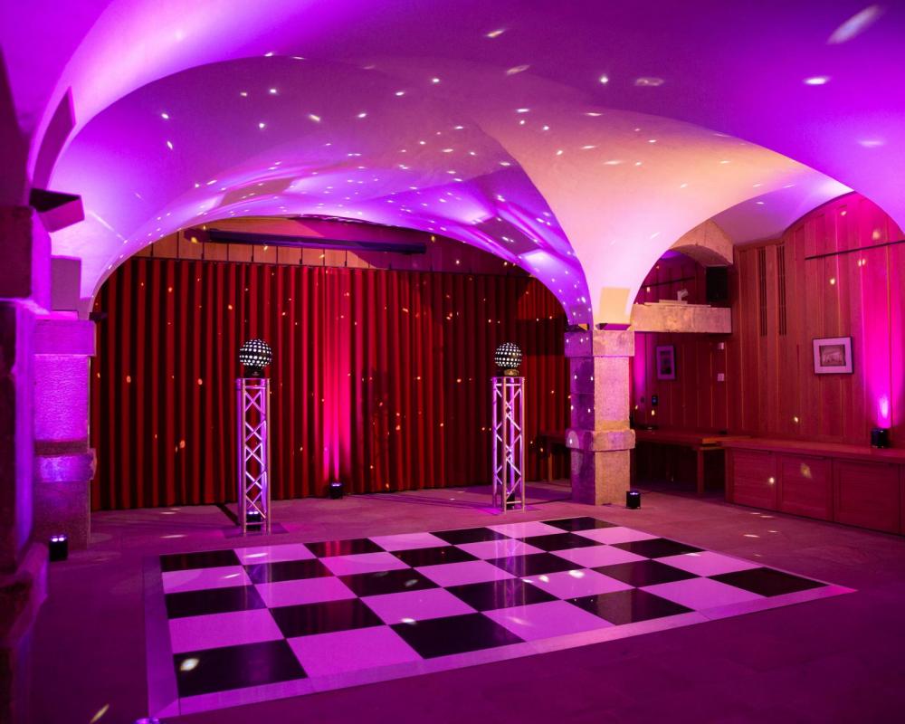 Stylish event space in The Crypt, Christ Church Spitalfields with checkered dance floor. - Banner