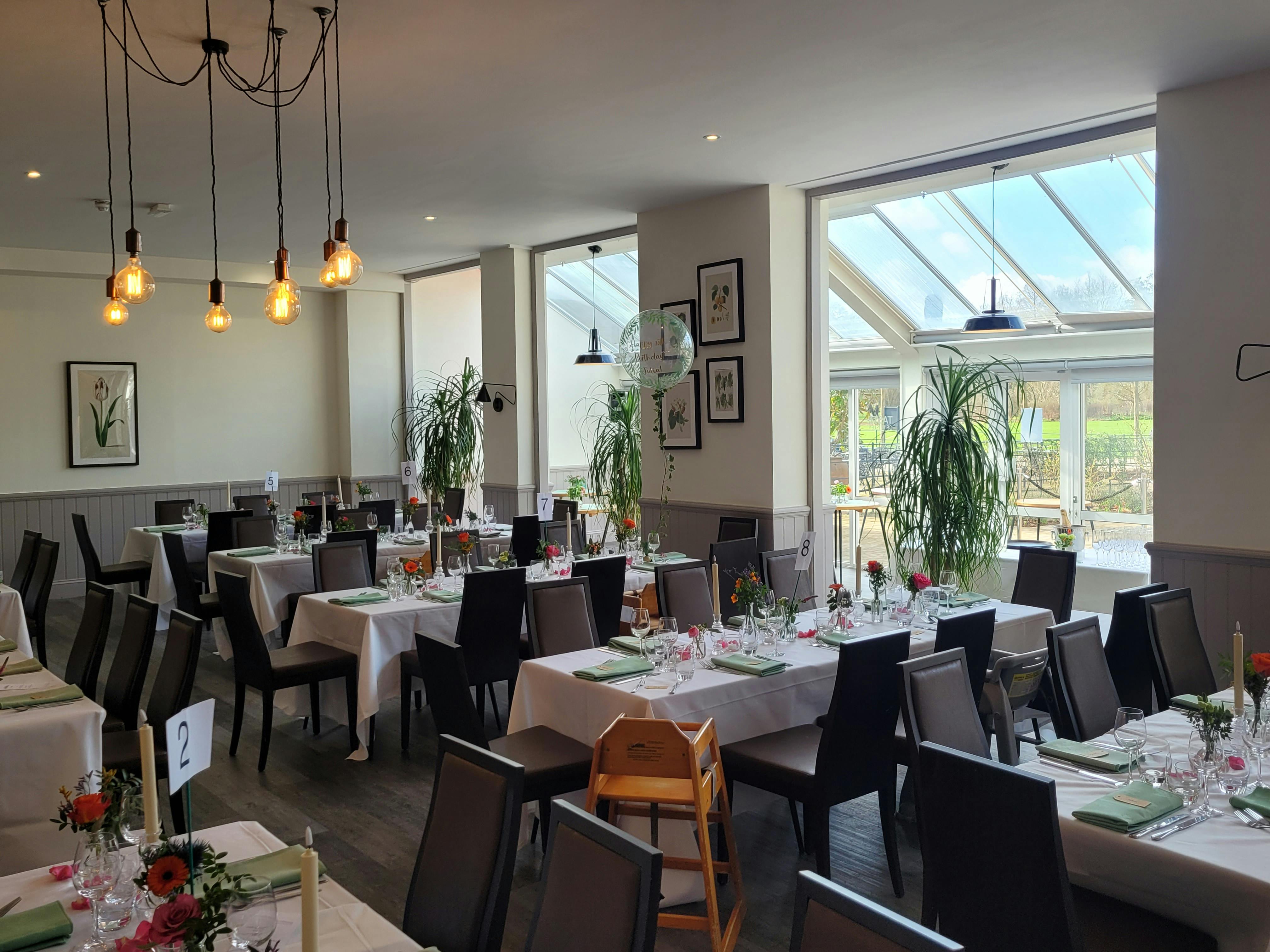 Tulip Tree Room at RHS Garden Wisley, elegant dining space for events with natural light.