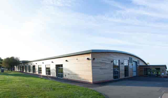 Maidstone Exhibition Hall: modern venue with wooden exterior for events and meetings.