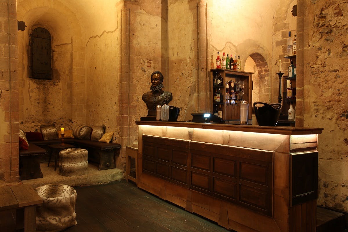 Garrison Floor at Hedingham Castle: rustic bar in a historic event space for gatherings.