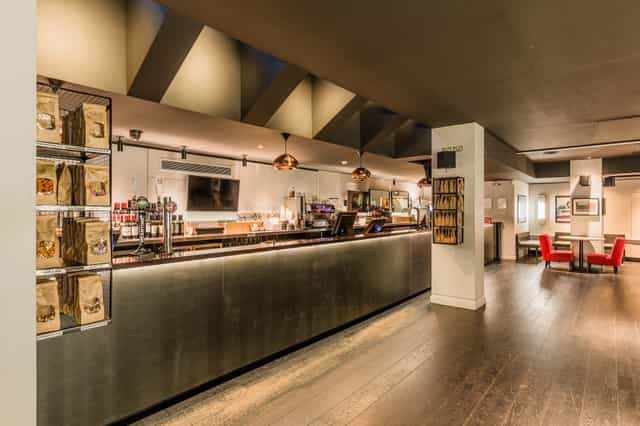 Modern bar area at Curzon Soho with sleek finishes, perfect for networking events.