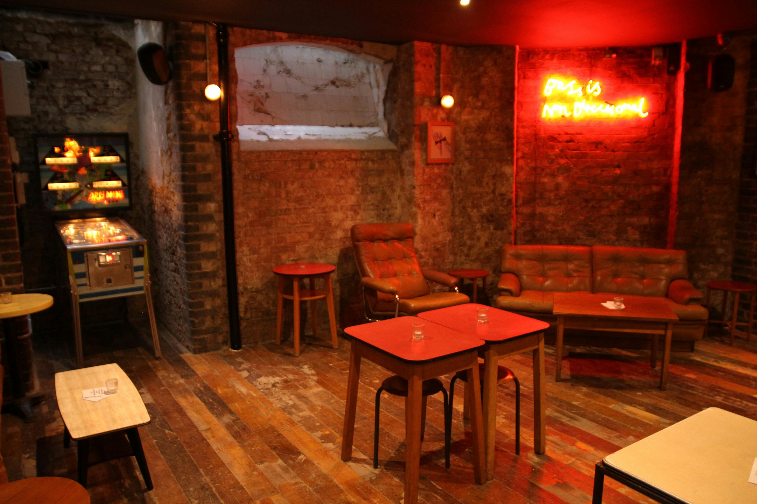 Cozy Basement Bar in Coin Laundry, rustic venue for intimate gatherings and networking.