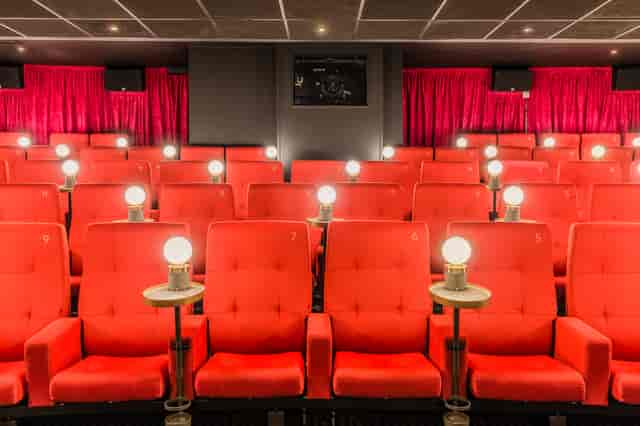 Intimate Curzon Mayfair theater with plush red seating, ideal for film screenings and events.