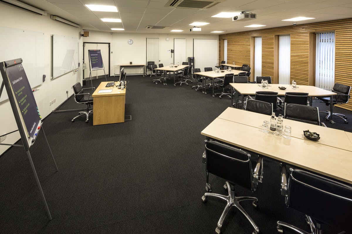 South West Room at Egrove Park, Oxford: modern meeting space for workshops and corporate events.