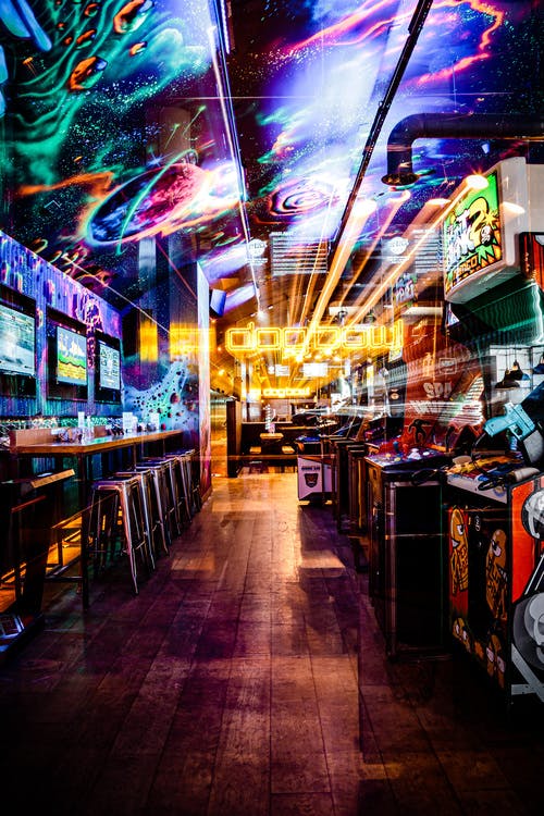 Vibrant Dog Bowl venue with neon signage for dynamic events and team-building activities.