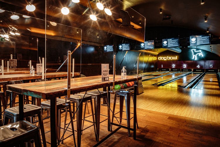 Vibrant bowling venue with modern decor for corporate events and team-building activities.