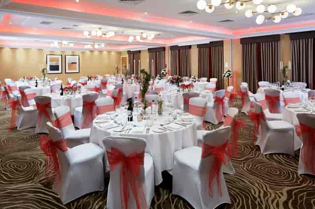 Elegant Kings Suite banquet hall with round tables, perfect for weddings and corporate events.
