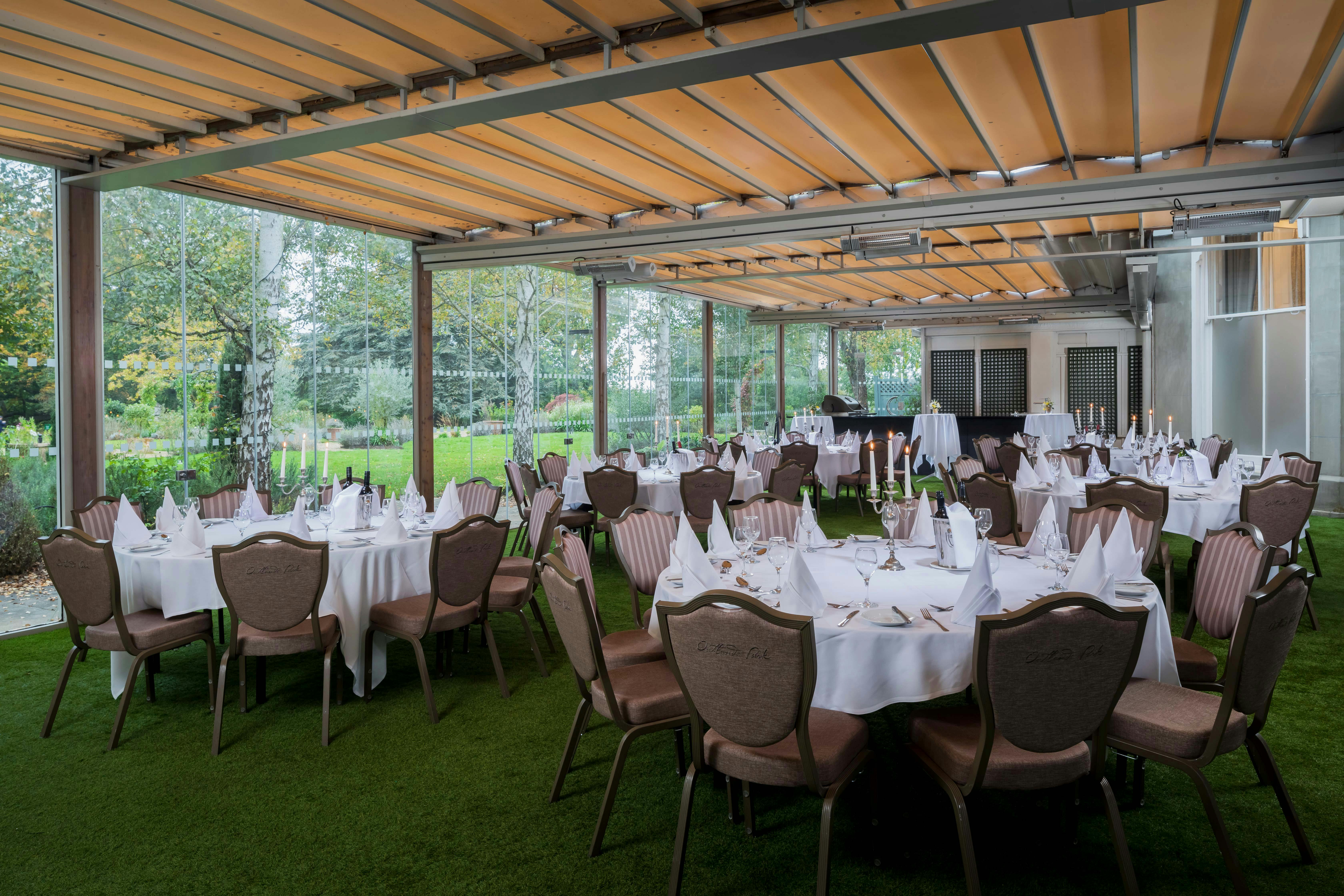 Elegant event space at Oatlands Park Hotel with round tables, ideal for weddings and gatherings.