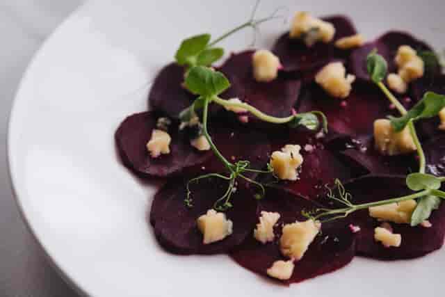 Upscale beet dish with cheese and microgreens at Oatlands Park Hotel event catering.