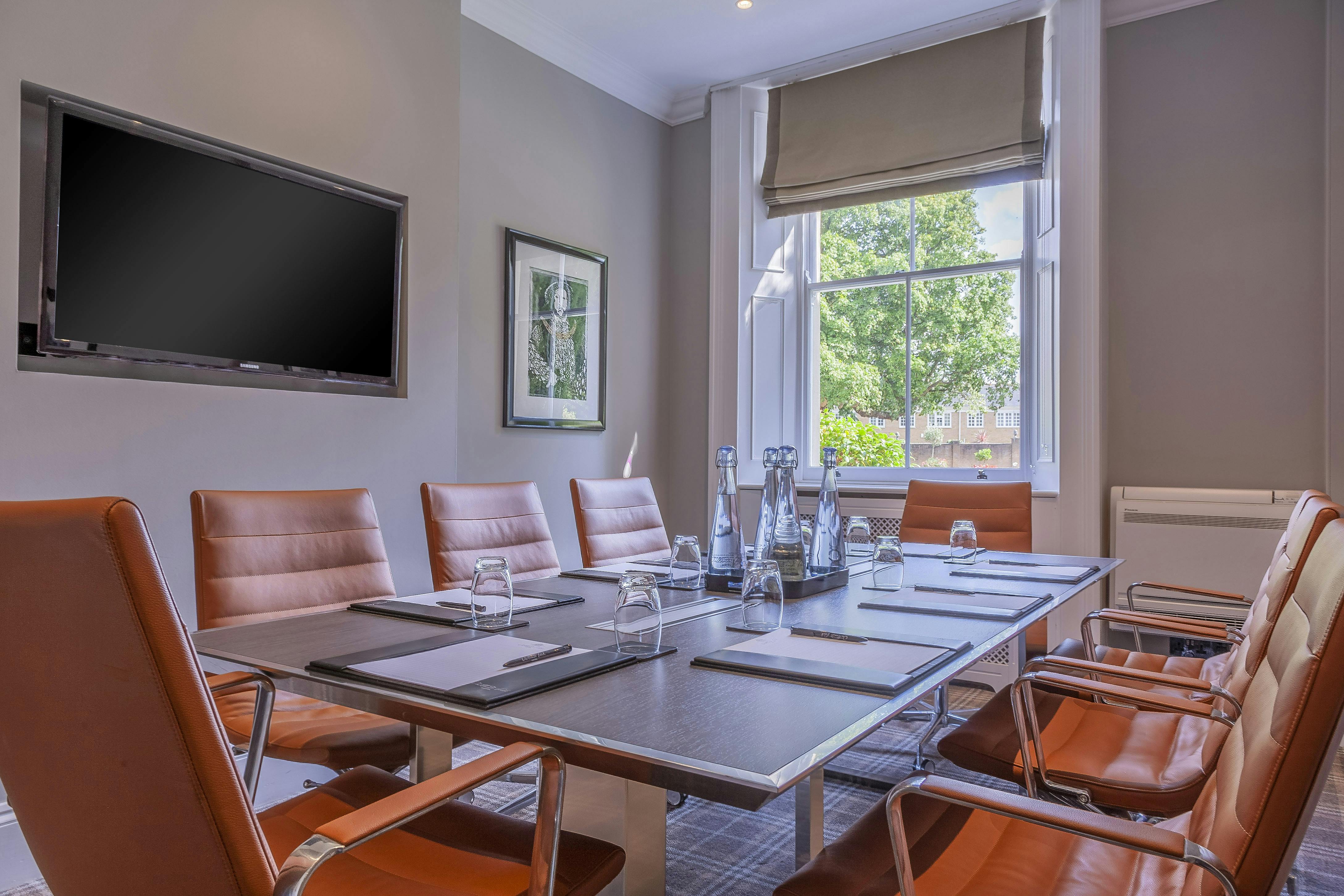 Howard Room at Oatlands Park Hotel, modern meeting space with natural light for conferences.