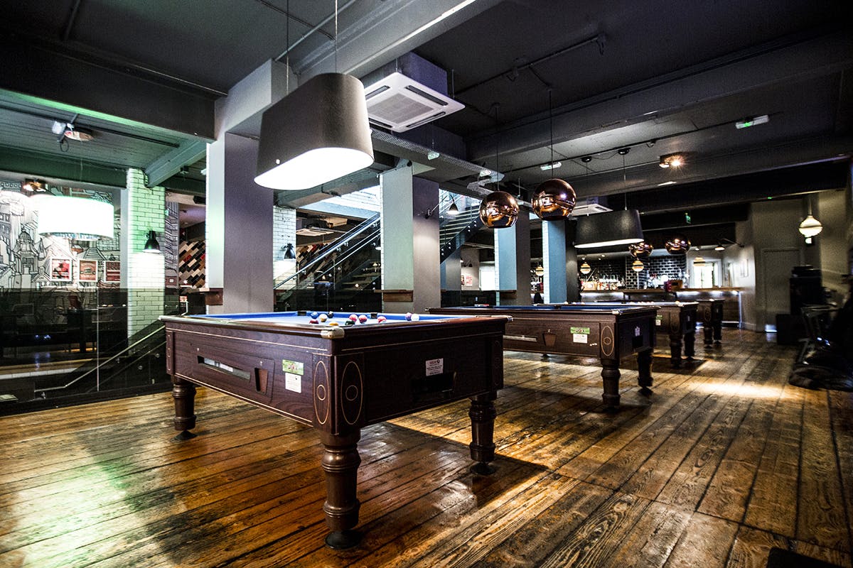 Stylish venue with pool tables for casual networking and team-building events.