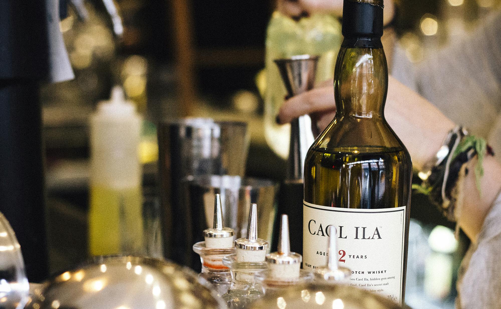 Premium Caol Ila whisky at a well-organized event bar setup for meetings and gatherings.